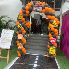 Danger, party zone ahead. This construction-themed balloon arch with custom warning signs makes for a fun and unique entrance to the birthday celebration.