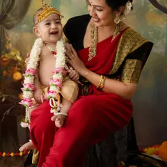 The pure joy of a mother and her little Krishna. This photo from a Janmashtami themed shoot captures a beautiful, candid laugh, celebrating both cultural tradition and a mother's love.