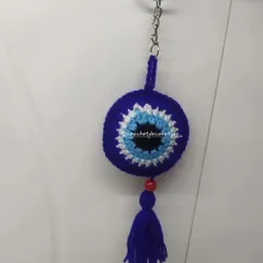 Our classic round crochet evil eye keychain, complete with a matching tassel. This protective charm is a popular gift to wish someone well and keep them safe from negative energy.