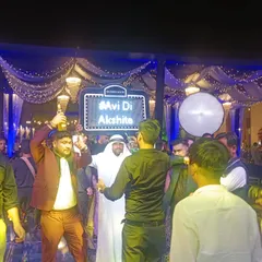 I bring the party to the dance floor with our famous "Habibi" act, serving shots and getting everyone hyped. We can even include a custom light-up sign with your wedding hashtag.