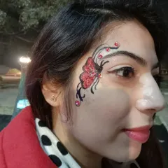 I love adding extra details like these small red gems to make a design stand out. This red glitter butterfly with black linework is a bold and dramatic choice for evening events.
