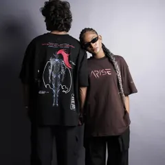 This image highlights the back graphic of the t-shirt, a key selling point for many streetwear brands. The models' connected pose creates a visually interesting composition that feels both stylish and intimate.
