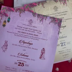 A set of lavender-hued inserts for the wedding and other ceremonies, adorned with illustrations of hanging lanterns and bougainvillea.
