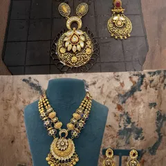 A side-by-side look at how we combine different elements. We took a pendant and chain, added new layers, blue stones, and kundan work to create a heavy, layered necklace set that makes a real statement.