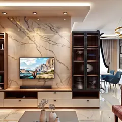 A sophisticated living room at SBR Pravanika featuring a marble-finish TV wall panel, custom shelving, and elegant lighting that creates a luxurious ambiance.