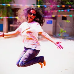 The pure exhilaration of a Holi dance party, captured mid-jump. My goal is to get everyone moving, laughing, and having the time of their lives.