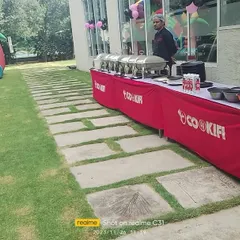 An outdoor catering setup for a kid's birthday party. We can arrange our services in any space, including lawns and clubhouses, to match your event's needs.