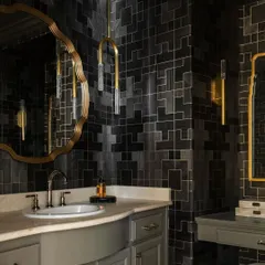 Another angle of the powder room, showcasing how the 'Fretwork' wallpaper wraps the space in its complex geometric design. The pattern creates a sense of depth and drama, enhanced by the warm glow of the lighting.