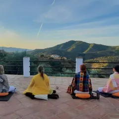Students engage in morning meditation at our retreat in Málaga, Spain. We practice in serene natural settings, allowing the beauty of the surroundings to quiet the mind and deepen the meditative experience.