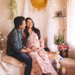A bright and airy shot of the couple in our bohemian setup. The magical light effects and their happy smiles capture the enchanting feeling of waiting for their little one.