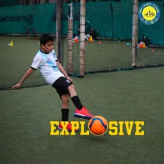 A young player unleashes an explosive kick, demonstrating the power and passion we nurture. Our turf provides a professional-quality surface for players to practice their shooting technique.