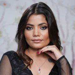 The final pose. This client is radiating confidence after her makeup session, showcasing a beautifully blended smokey eye and flawless complexion.