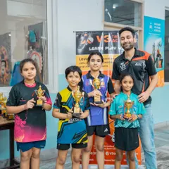 Nothing makes me prouder than seeing my students with their well-earned trophies. This picture captures the joy and success from our recent tournament, a testament to their dedication.