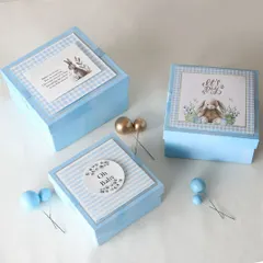Our return favor hampers come in various styles. These elegant blue boxes were created for a baby boy's announcement, with three different curated options for guests to choose from.