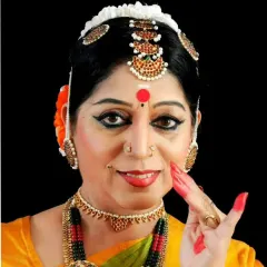 A portrait of me in full Bharatanatyam attire, demonstrating a 'mudra'. This image represents my identity as a performer and teacher, carrying forward the aesthetics and discipline of the Kalakshetra style.