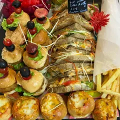 A High Tea platter designed for a special "get well soon" delivery. It includes mini burgers, club sandwiches, cheese buns, and french fries.