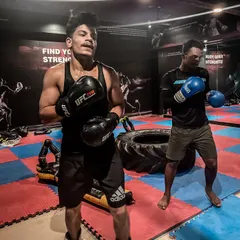 If you want something, you have to learn to fight for it. Here, two of my fighters catch their breath after a tough drill, showing the grit required to train here.