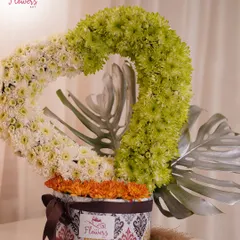 Another angle of the heart-shaped floral arrangement, showing its structure and the contrast between the sculpted heart and the loose flowers at the base. This is a true statement piece.