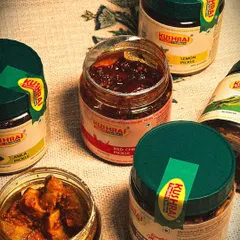 A glimpse of the variety I offer. Here you can see open jars of my Mango, Red Chilli, and Ginger Garlic pickles, showing the rich texture and real ingredients I use. It's the true taste of Punjabi 'ghar ka swad'.