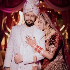 An intimate moment between Darshil and Bhagyashree, showcasing the rich velvet and intricate embroidery of their wedding attire. I focus on capturing the quiet connection that speaks volumes.