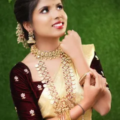 A joyful, candid shot of a model during a bridal photoshoot. The makeup is designed to look great both on camera and in person, capturing her radiant smile.