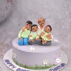 A sweet birthday cake for a 'Thatha' (grandfather) surrounded by his grandchildren. Creating these family portrait cakes is incredibly special, as they become a centerpiece for a cherished memory.