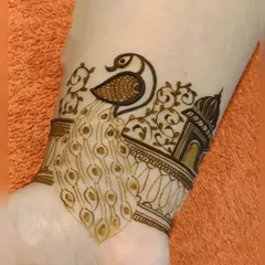 A close-up of a wristband design showing a peacock perched near a 'jharokha' or traditional window. These elements are hallmarks of my Rajasthani design style.