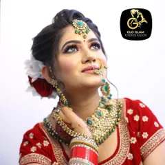 A close up of one of my brides, showcasing a classic Indian bridal makeup look. Notice the perfectly blended eyeshadow, sharp winged liner, and how the makeup complements her red lehenga and traditional jewellery for a timeless and elegant result.