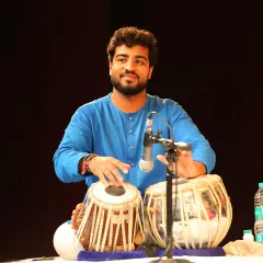 On stage at the Debadhara Festival in Delhi. Performing live is a different kind of energy. This photo captures a moment of joy and concentration as I accompany a performance, connecting with the audience through the language of the tabla.