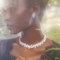 An ethereal shot for a luxury jewellery campaign. We created a magical, forest-like atmosphere with soft, diffused light to make the diamond necklace and earrings stand out beautifully.