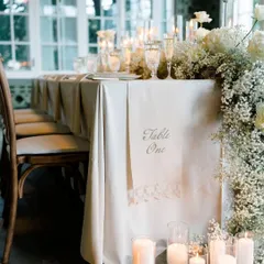 This perspective showcases the cascading floral arrangement and candlelit floor of the elegant tablescape. It’s a testament to how I layer textures and light to build a truly immersive and luxurious atmosphere.
