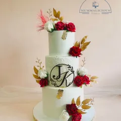 This is where elegance meets love. Our three-tiered wedding cake, personalized with the couple's initials and adorned with handcrafted red and white sugar roses, is designed to be the stunning centerpiece of your special day.