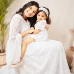 A bright and airy portrait of a mother and daughter sharing a happy moment. Dressed in coordinating white lace, their genuine smiles and easy embrace radiate pure love and connection. This is the kind of simple, beautiful memory I love to preserve.