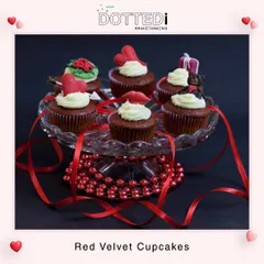A platter of delicious red velvet cupcakes with custom Valentine's Day toppers. These sweet treats are a perfect edible gift for any special occasion.