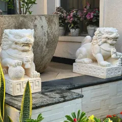 Guard your home with style and tradition. This pair of majestic sandstone Foo Lions, one male and one female, are placed at an entrance to bring protection and a sense of grandeur.