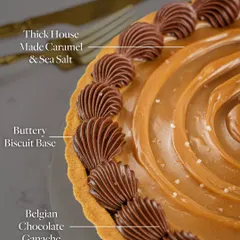 This image breaks down the delicious components of my Chocolate Pudding Tart, showing the buttery biscuit base, the thick house-made caramel, and the Belgian chocolate ganache.
