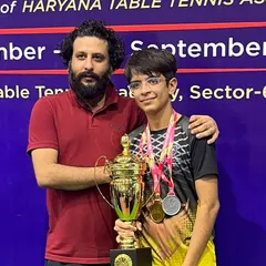 I am incredibly proud to stand with one of our state champions after his win. This trophy represents countless hours of practice, focused table tennis drills, and a commitment to excellence.