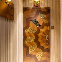 First impressions are everything. We designed this custom main door with intricate geometric patterns in wood and brass, setting a tone of bespoke elegance and craftsmanship from the moment you arrive home.