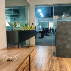 A look inside the Smallcase office we designed. This space balances natural elements like wood flooring and planters with industrial touches like glass walls and a concrete-finish divider.