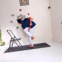 Yoga should be accessible to everyone. Here, I demonstrate a variation of the Revolved Bird of Paradise pose using a chair for support. This is an example of adaptive yoga, where we use props to make even advanced postures achievable, ensuring a safe and effective practice for those with limited mobility.