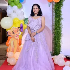 A happy client celebrating her child's birthday in my lavender gown. This dress features beautiful 3D floral and leaf embroidery on the bodice and skirt.