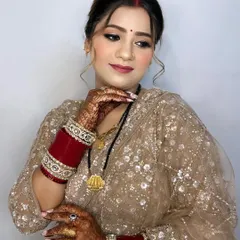 A beautiful pose showing off her flawless makeup and intricate henna design.