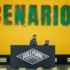 On the decks representing Gully Gang at the YouTube FanFest. This shot captures me in my element, focused on the music and the moment, with the iconic Gully Gang logo backing me up.