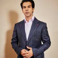 Actor Rajkummar Rao in a bespoke pinstripe suit. This highlights the core of my craft: impeccable tailoring that fits like a second skin, elevated by subtle details like the contrast red stitching on the buttonholes for a signature edge.