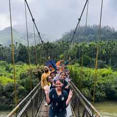 It's all about the journey and the people you share it with. Our group crossing a suspension bridge shows the fun, adventure, and teamwork that's part of every trip.