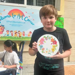 We had such a wonderful time at our first Farmers Market! It was pure joy to see kids and parents enjoying our art corner. This young man is so proud of the beautiful floral plate he painted.