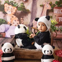 A full view of the jungle setup, with our little panda surrounded by his stuffed animal friends.
