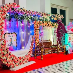 This elaborate baby shower decoration was set up on a terrace in Dombivli. It features a floral moon seat, a decorated jhula, and a custom photo backdrop, showing how I can transform any space into a beautiful venue.