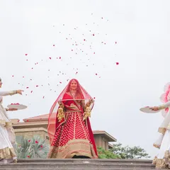 The bride's grand entrance, flanked by dancers and showered with petals. We make sure her walk инновацион is a moment of pure elegance and anticipation.