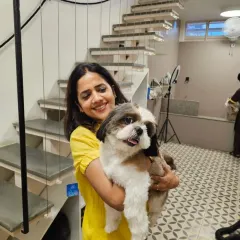 A moment of connection with a sweet Shih Tzu. We believe that hands on, loving care is key to a positive grooming and daycare experience for every animal.